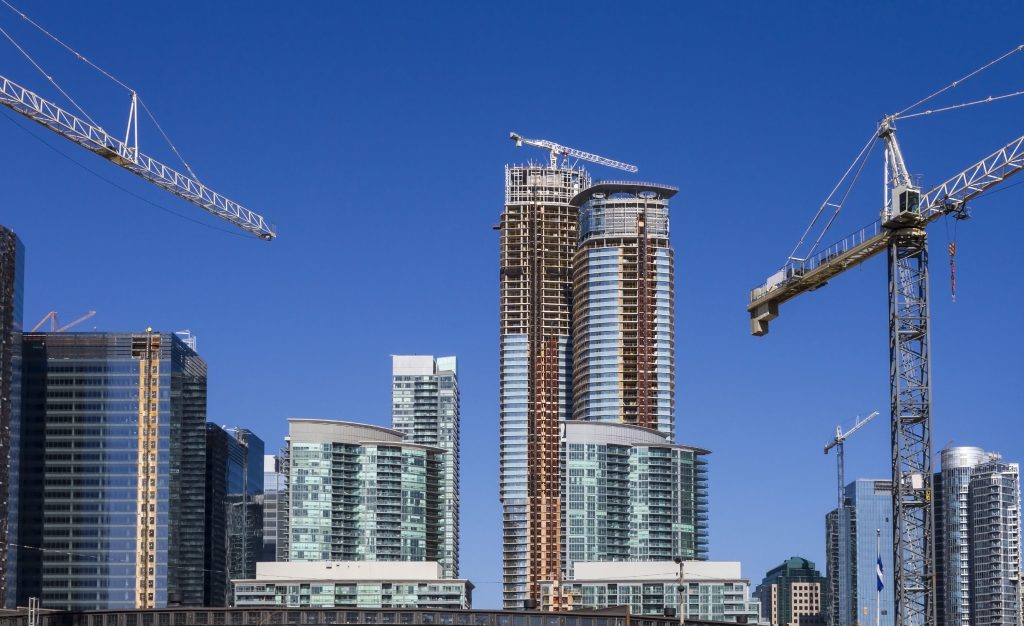 skyscrapers being constructed in a large city